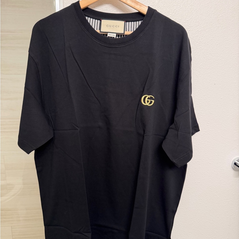 Gucci Black Tee with Gold Emblem
